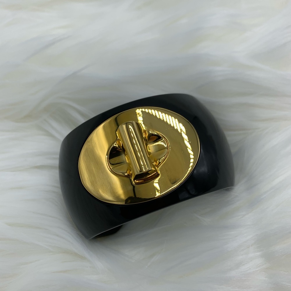 Coach black/gold resin turn lock open cuff